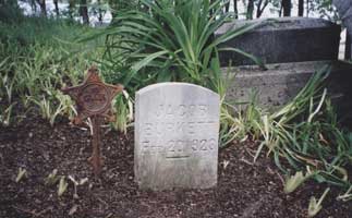 Jacob Burkett with GAR marker is close to Burkett family monument