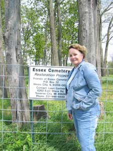 Tizza Meyer with 
the new Essex Cemetery Sign